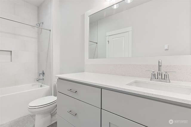 bathroom featuring shower / bath combination, toilet, and vanity