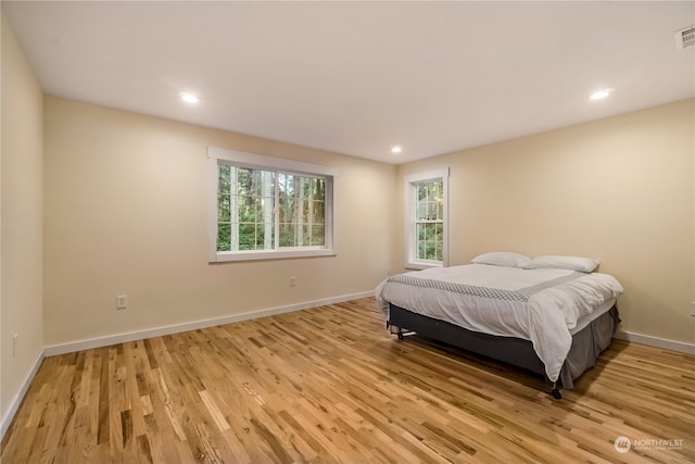 bedroom with light hardwood / wood-style flooring