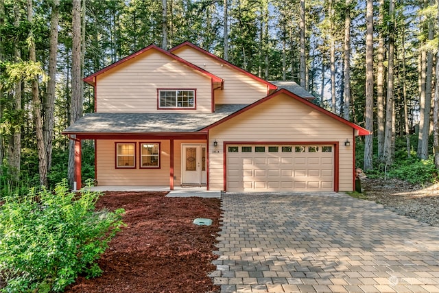 view of front of house with covered porch and a garage