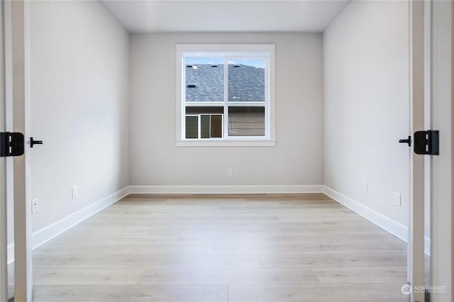 spare room featuring light hardwood / wood-style flooring