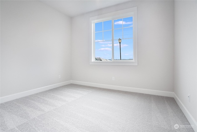 unfurnished room featuring carpet