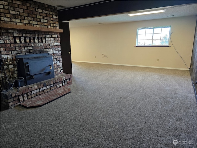 unfurnished living room featuring a fireplace and carpet