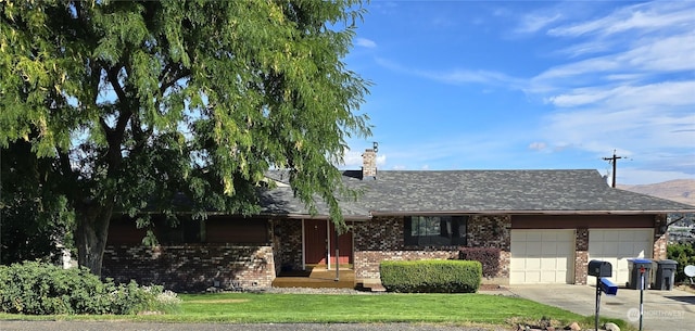 single story home with driveway, a front lawn, an attached garage, brick siding, and a chimney