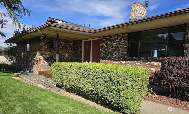 exterior space with brick siding