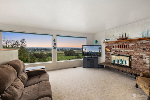 living room with carpet floors and a fireplace