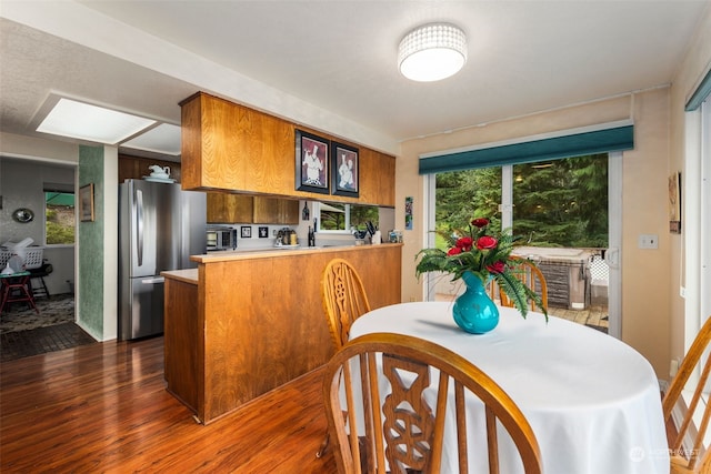 dining room with dark wood-type flooring