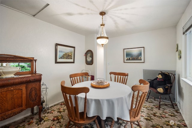 dining room featuring light carpet