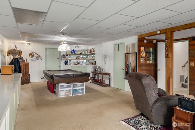 rec room with indoor bar, pool table, and light carpet