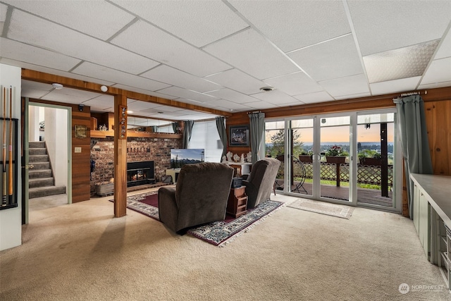 carpeted living room featuring a brick fireplace