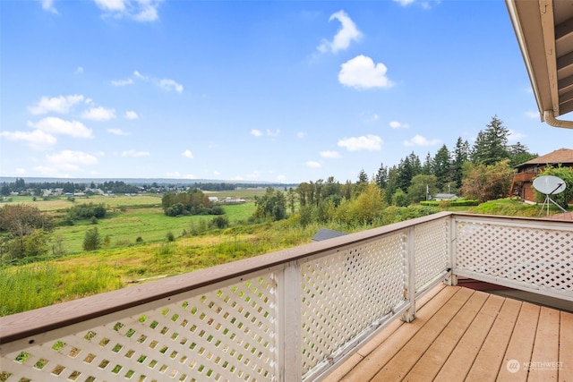 wooden deck featuring a rural view