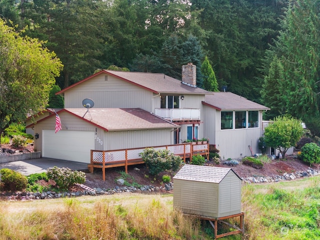 exterior space with a wooden deck and a garage