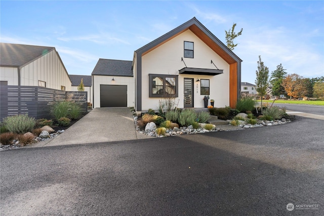 modern inspired farmhouse featuring a garage