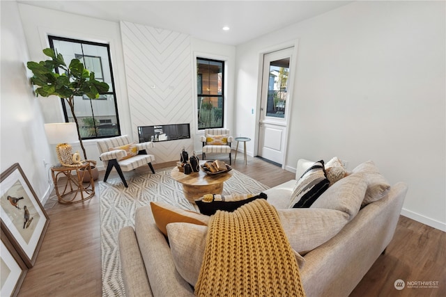 living room featuring a wealth of natural light and hardwood / wood-style flooring