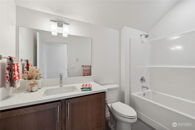 full bathroom with vanity, toilet, bathtub / shower combination, and lofted ceiling