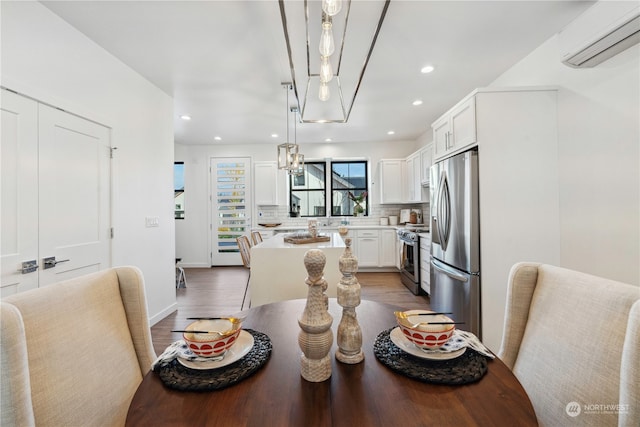 dining room with dark wood-type flooring and a wall mounted air conditioner