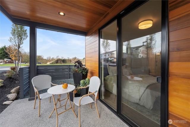 sunroom with wooden ceiling