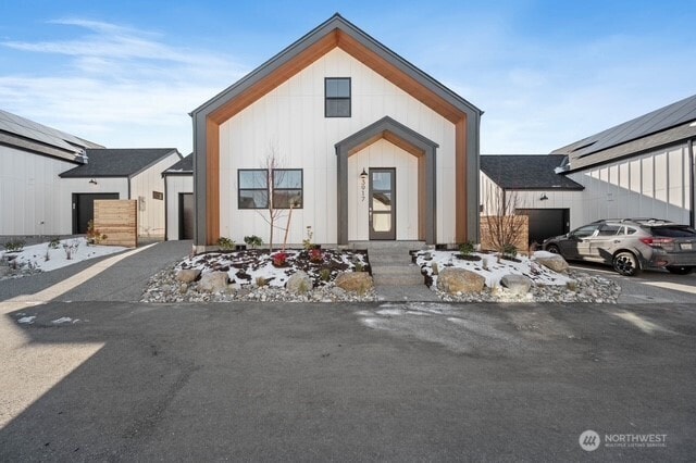 modern farmhouse style home with a garage