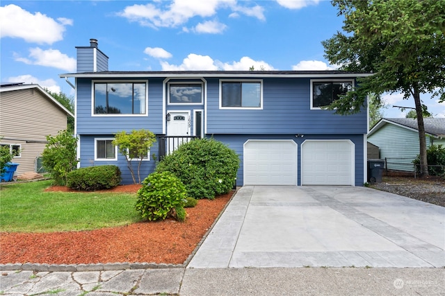 split foyer home featuring a garage