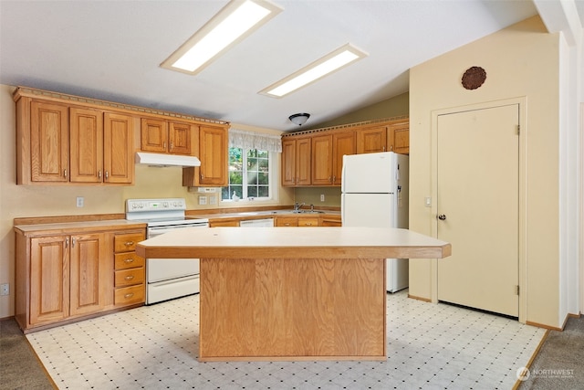 kitchen with white appliances, a kitchen island, sink, and lofted ceiling