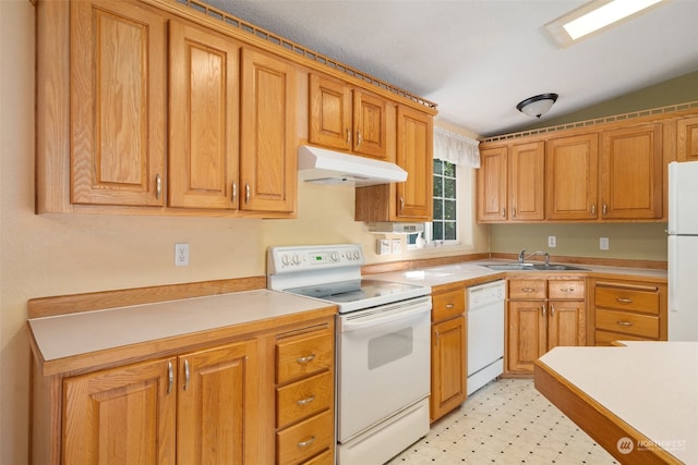 kitchen with vaulted ceiling, sink, and white appliances