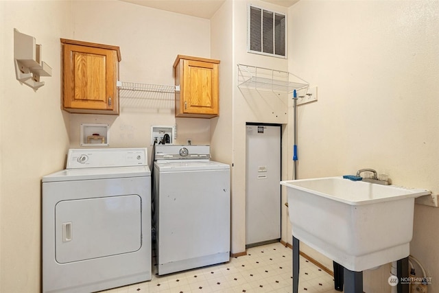 11 SE Fuchsia Ave, Shelton, WA 98584 - clothes washing area with washing machine and dryer, cabinet space, and light flooring