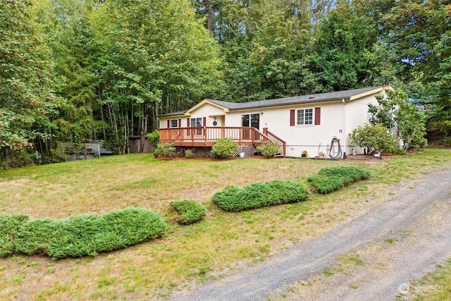 11 SE Fuchsia Ave, Shelton, WA 98584 - view of front facade with a deck and a front yard