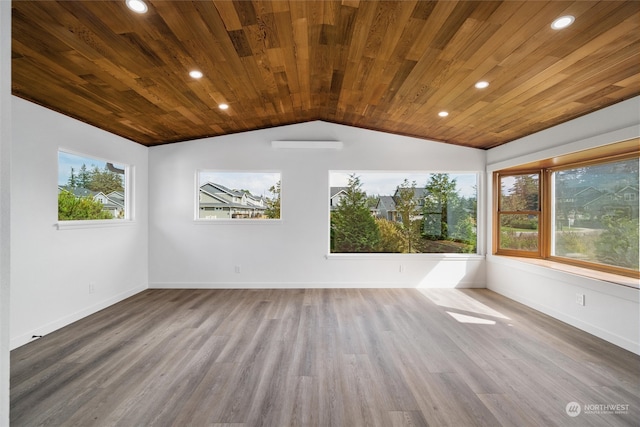 unfurnished room with wooden ceiling, vaulted ceiling, a healthy amount of sunlight, and wood-type flooring