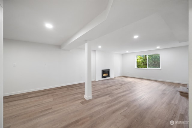 basement featuring light hardwood / wood-style floors