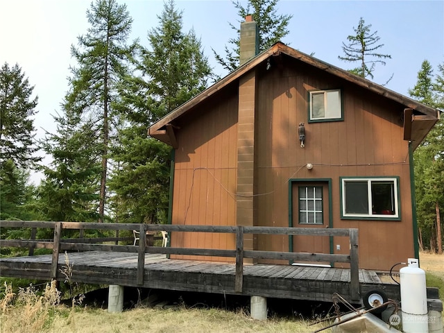 view of property exterior featuring a deck