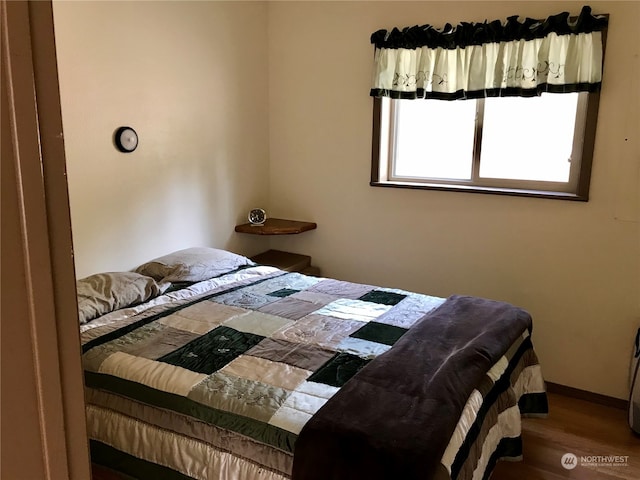 bedroom featuring hardwood / wood-style floors