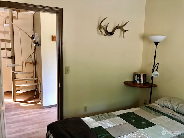 bedroom with hardwood / wood-style flooring