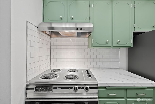 kitchen featuring stainless steel electric range, exhaust hood, green cabinetry, and decorative backsplash