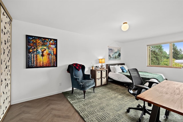 bedroom featuring parquet flooring