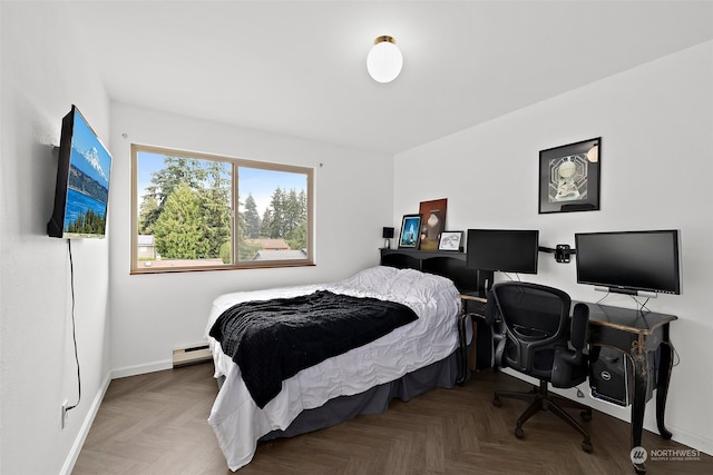 bedroom featuring a baseboard radiator and parquet flooring