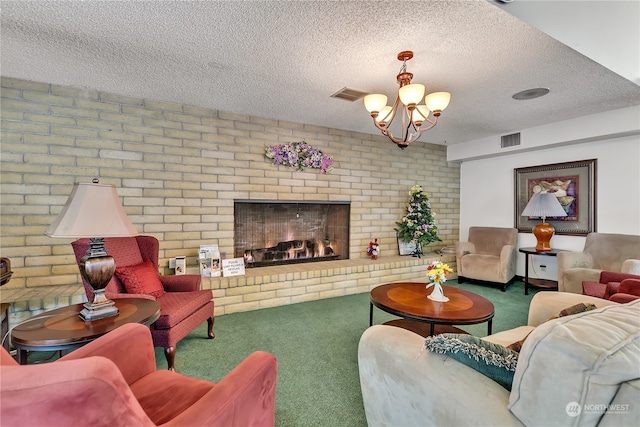 carpeted living room featuring a textured ceiling, a brick fireplace, brick wall, and an inviting chandelier