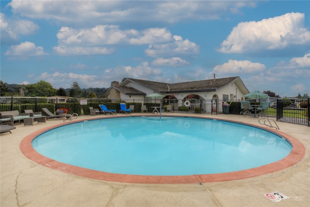 view of swimming pool with a patio area