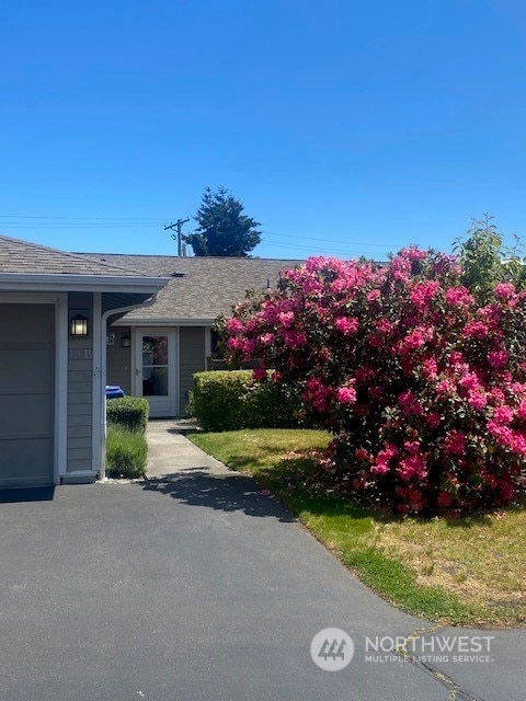 view of side of home featuring a garage