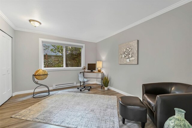 office area with crown molding, a baseboard radiator, and light hardwood / wood-style floors