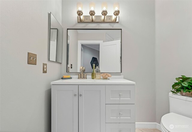 bathroom with vanity and toilet