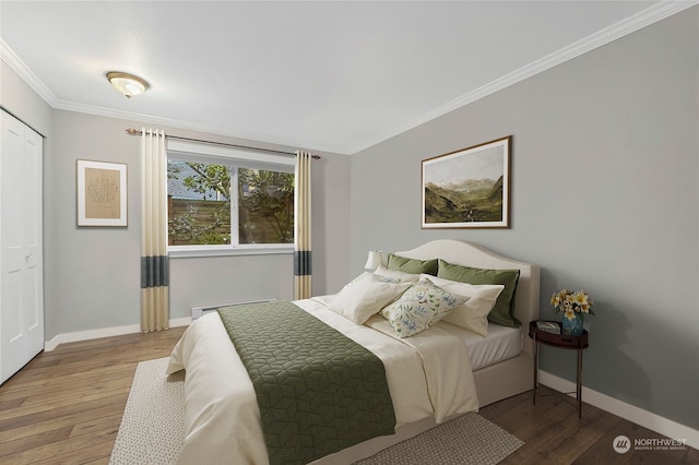 bedroom with crown molding and wood-type flooring