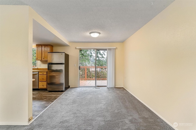 interior space featuring a textured ceiling