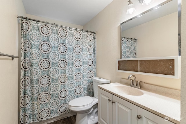 bathroom with a shower with curtain, wood-type flooring, toilet, and vanity