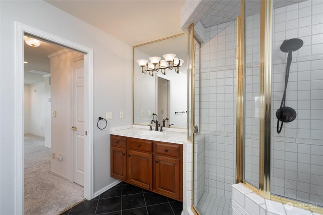 bathroom with tile patterned floors, walk in shower, and vanity