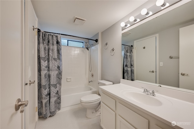 full bathroom featuring shower / bath combination with curtain, vanity, toilet, and tile patterned floors