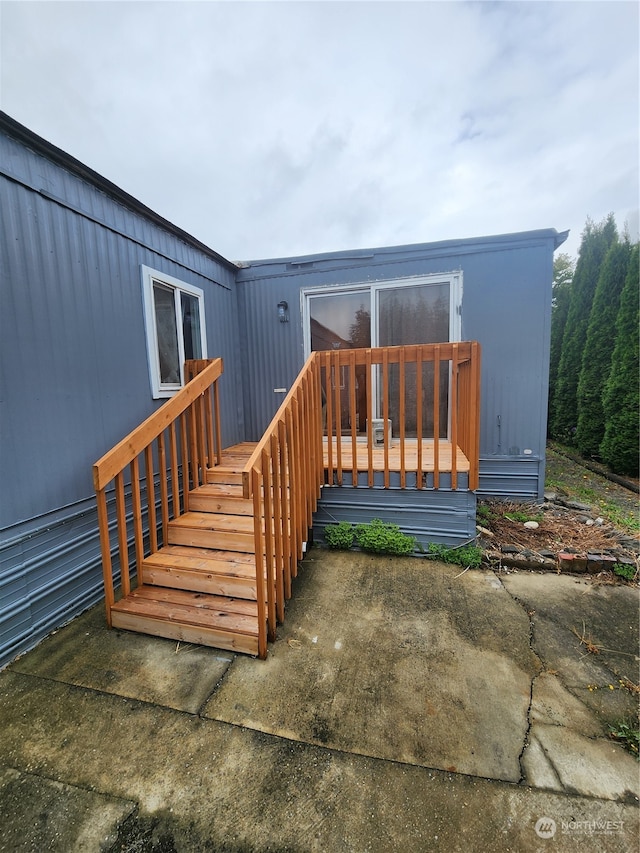 doorway to property featuring a patio area and a deck