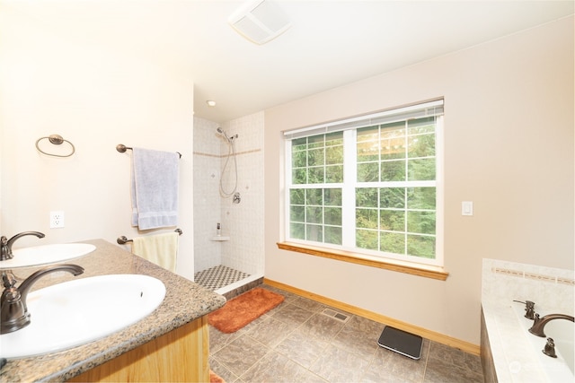 bathroom featuring separate shower and tub, plenty of natural light, and vanity