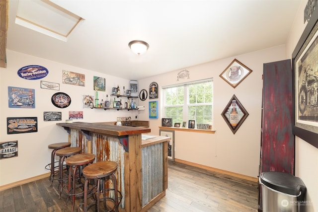 bar featuring wood-type flooring