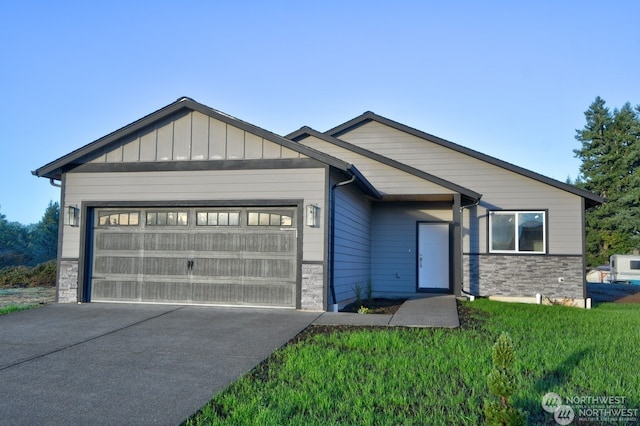 view of front of property with a front yard and a garage