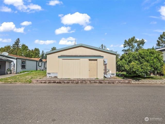 view of front of property with a shed