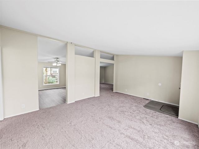 unfurnished room with carpet flooring and ceiling fan